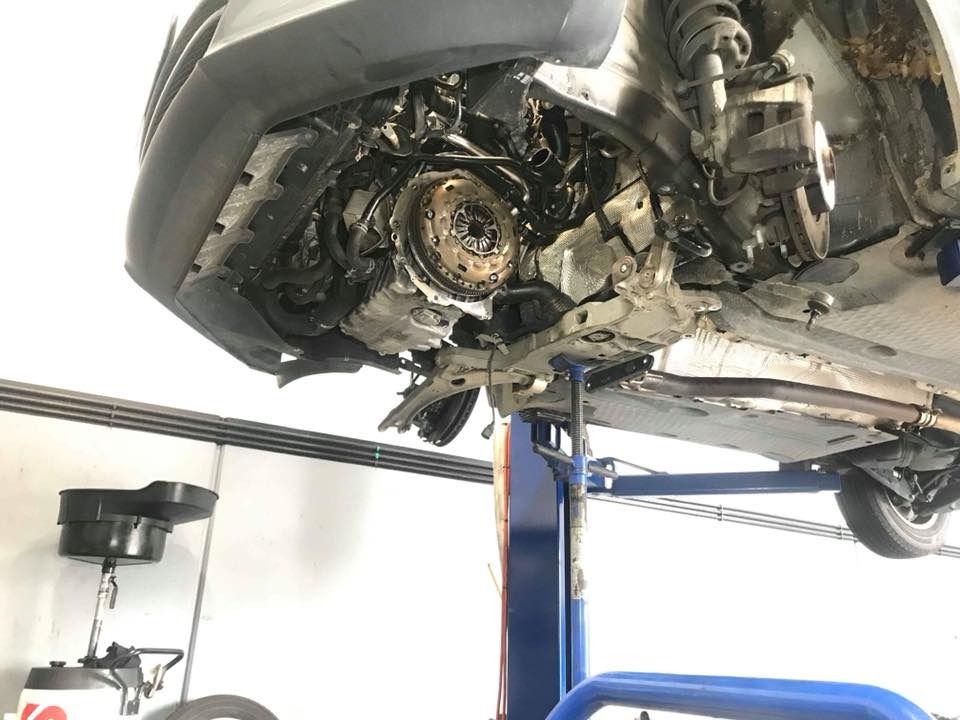 A Car Is Being Repaired On A Lift In A Garage — Browns Autobahn In Nambour, QLD