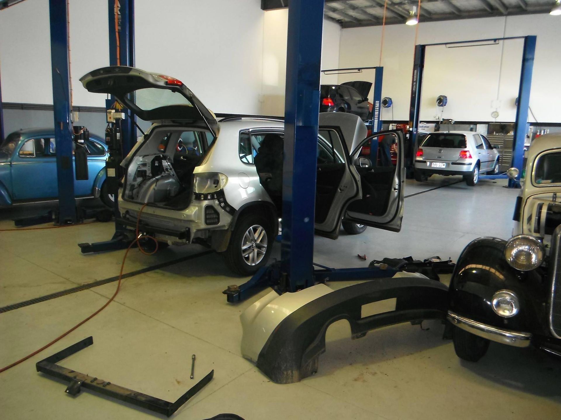 A Car Is Sitting On A Lift In A Garage — Browns Autobahn In Nambour, QLD