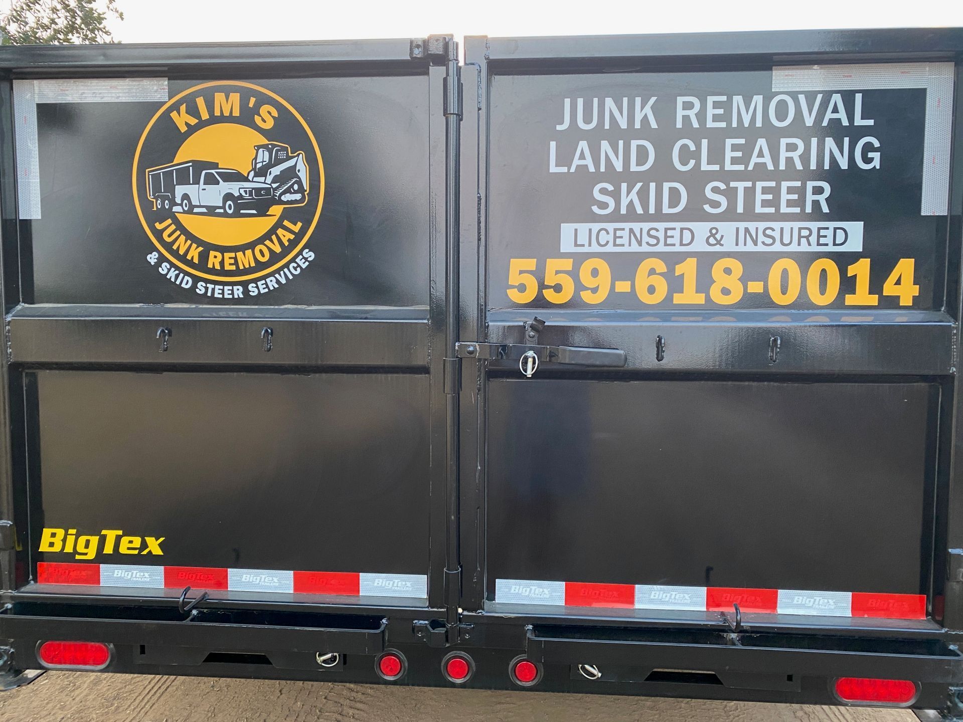 Junk removal truck with large sign: