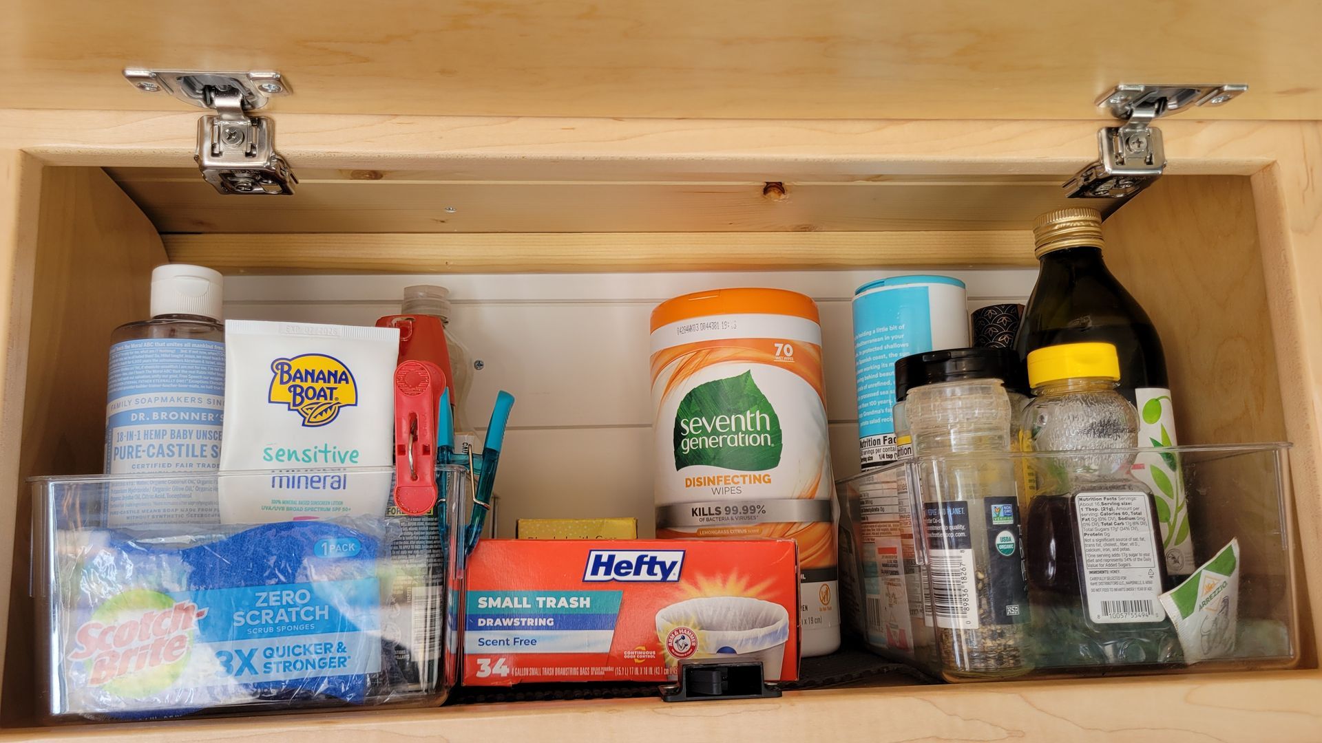 A bathroom cabinet with a lot of items in it