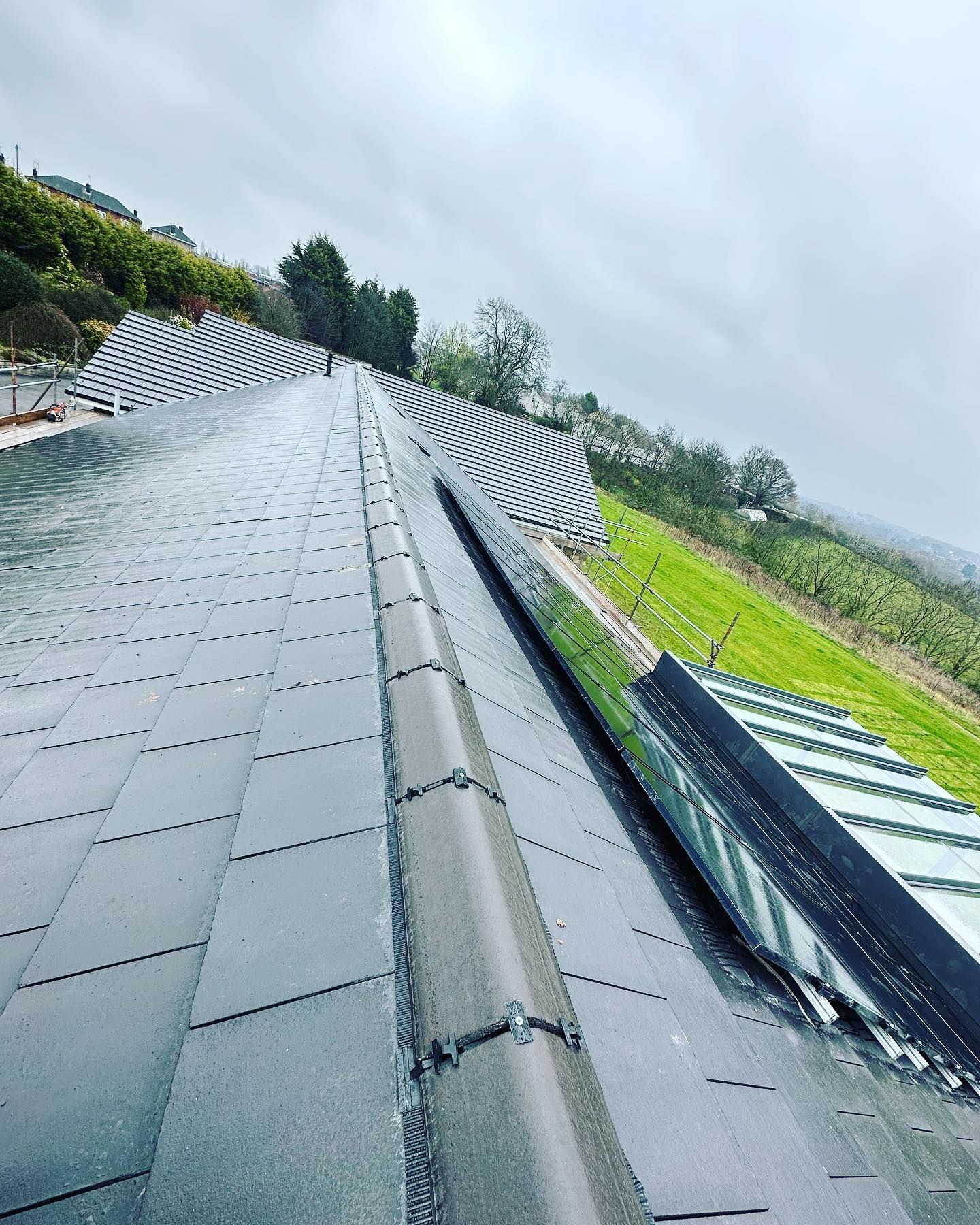 a picture of a roof replacement with solar panels by Hightop roofers Rotherham 