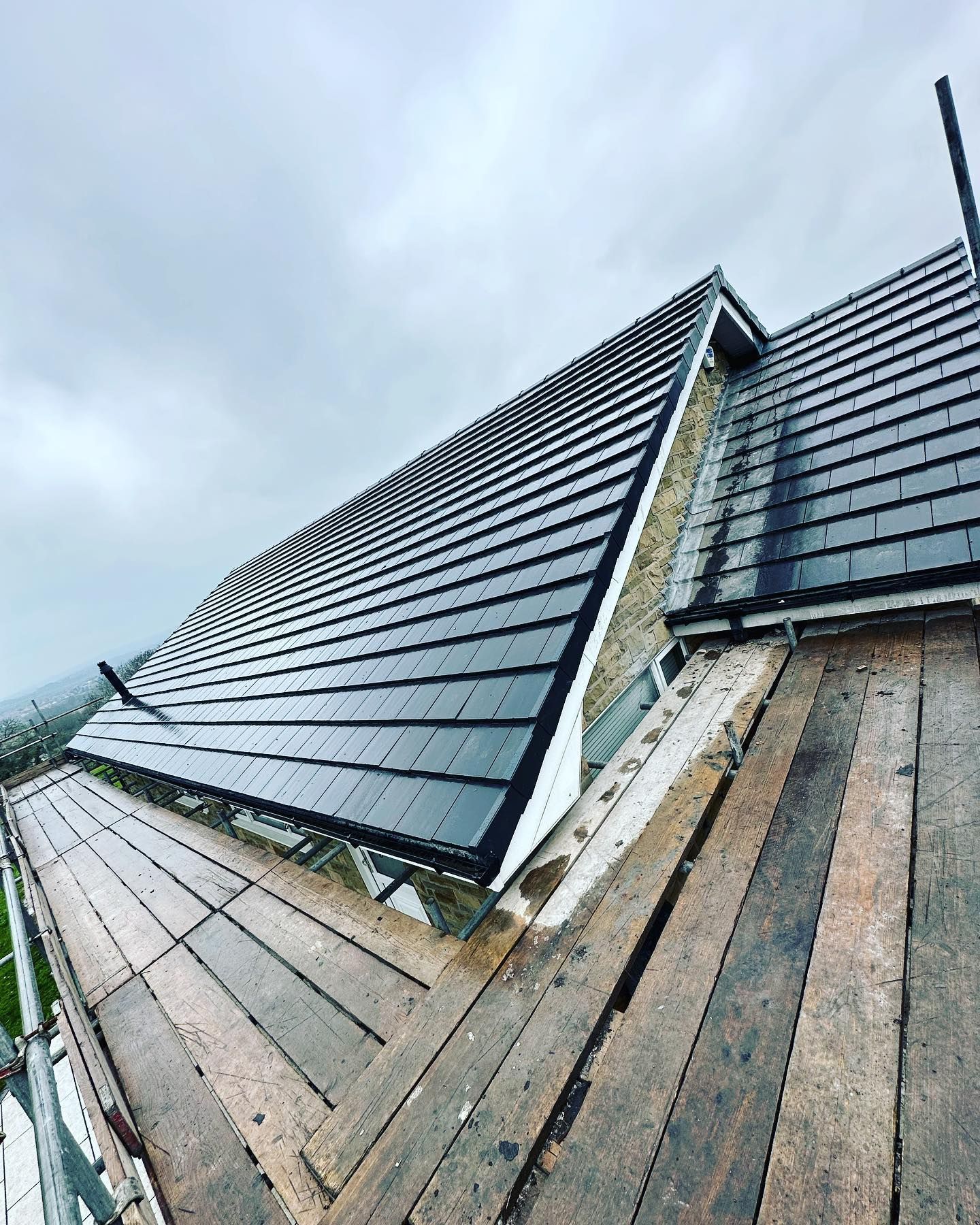 a picture of a slate roof replacement by Hightop roofers Rotherham