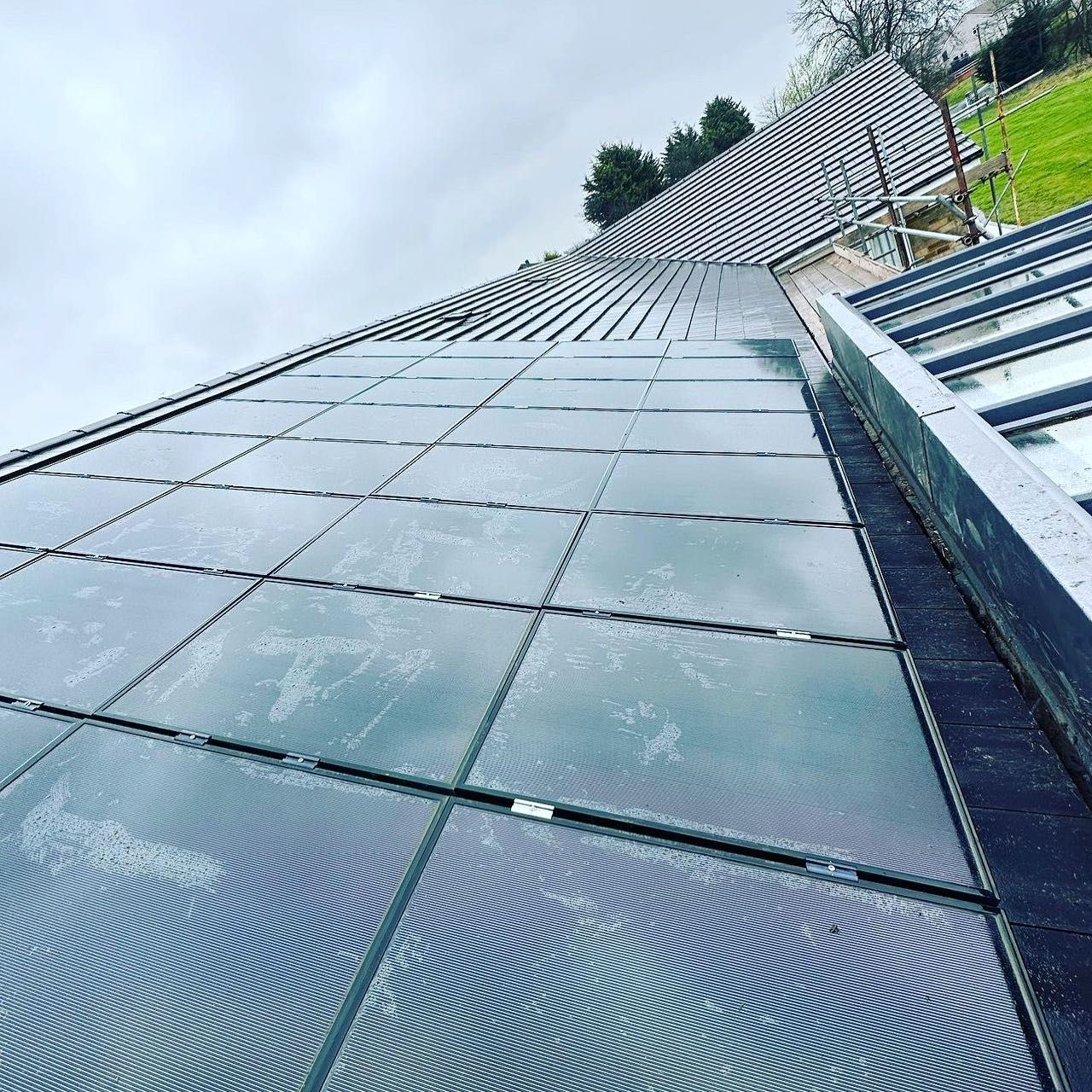 a picture of a roof replacement with solar panels by Hightop roofers Rotherham