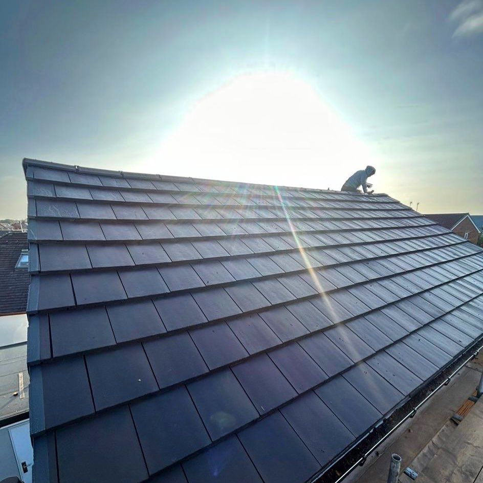 a picture of a slate roof replacement by Hightop roofers Rotherham