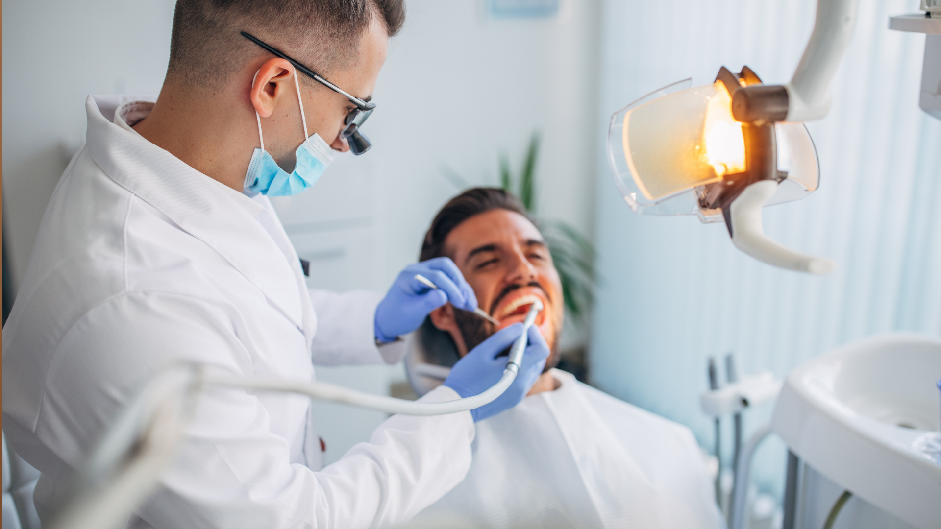 A dentist is examining a patient 's teeth in a dental office.