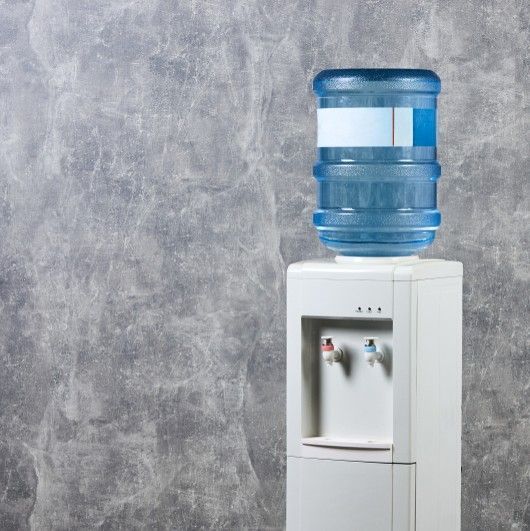 A White Water Dispenser With a Large Blue Water Jug on Top — Cool Blue Ice & Water in Singleton, NSW