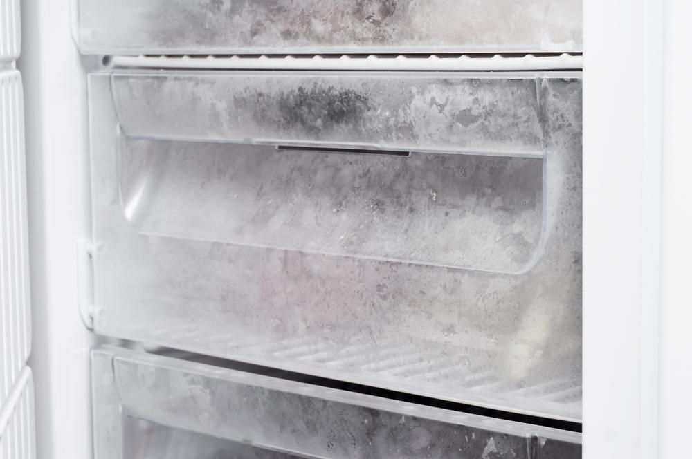 Close-up View of Multiple Freezer Drawers Filled With Significant Frost Buildup — Cool Blue Ice & Water in Glen Innes, NSW