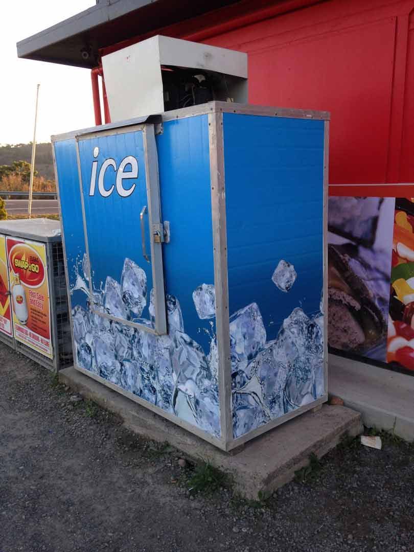 A Blue, Rectangular Ice Vending Machine Stands on a Concrete Pad Truck Commercial — Cool Blue Ice & Water in Taminda, NSW