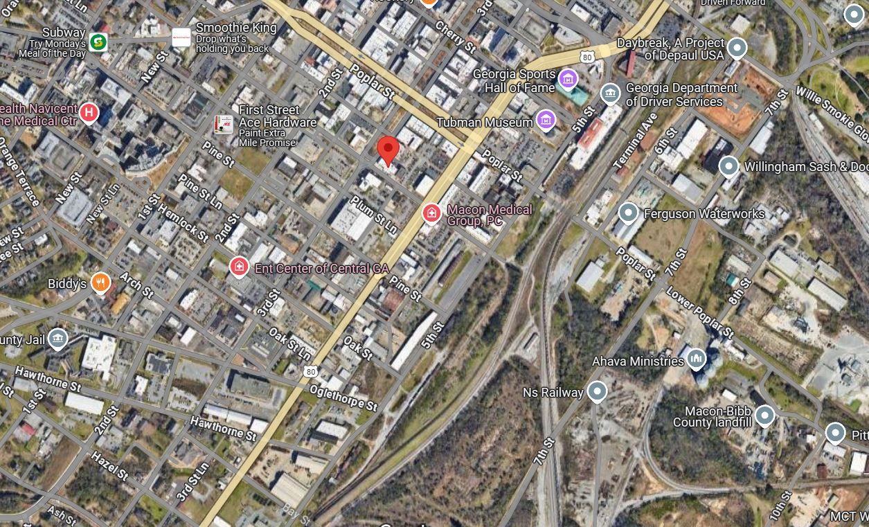 An aerial view of a city with a red circle in the middle.