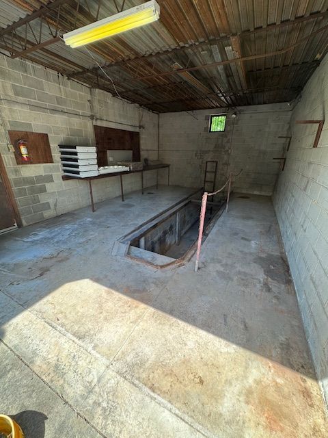 There is a hole in the floor in the middle of the room.