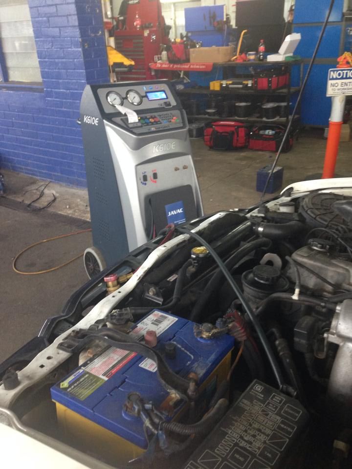 Car Engine Bay With a Diagnostic Machine — Gibbo's Auto Electrics & Air Conditioning Services in Lake Macquarie, NSW