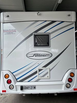 Rear View of a White Sunliner RV — Gibbo's Auto Electrics & Air Conditioning Services in Maitland, NSW