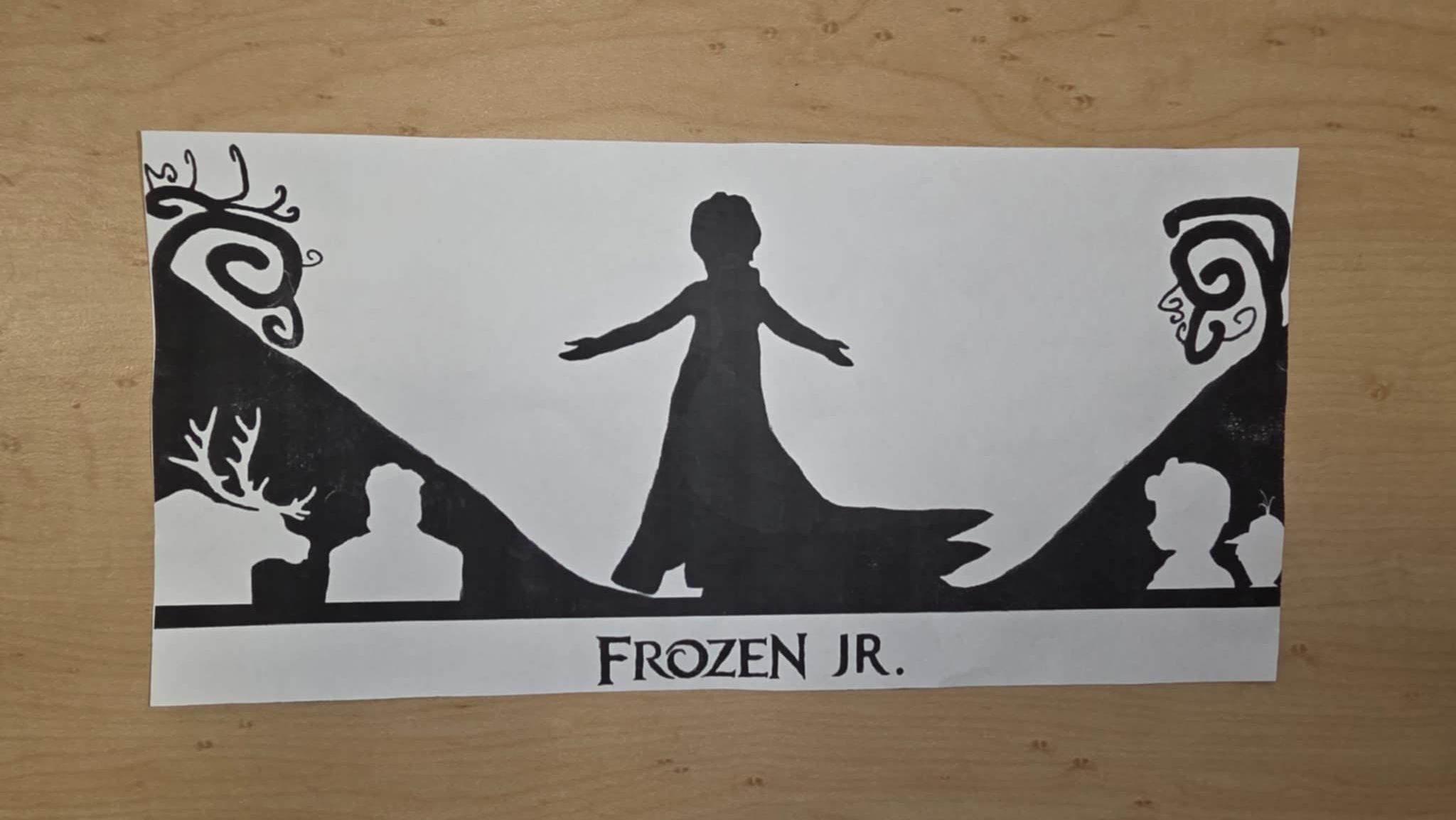 Silhouette of Elsa with outstretched arms, set against a dark landscape with characters from Frozen Jr., including deer and silhouettes.