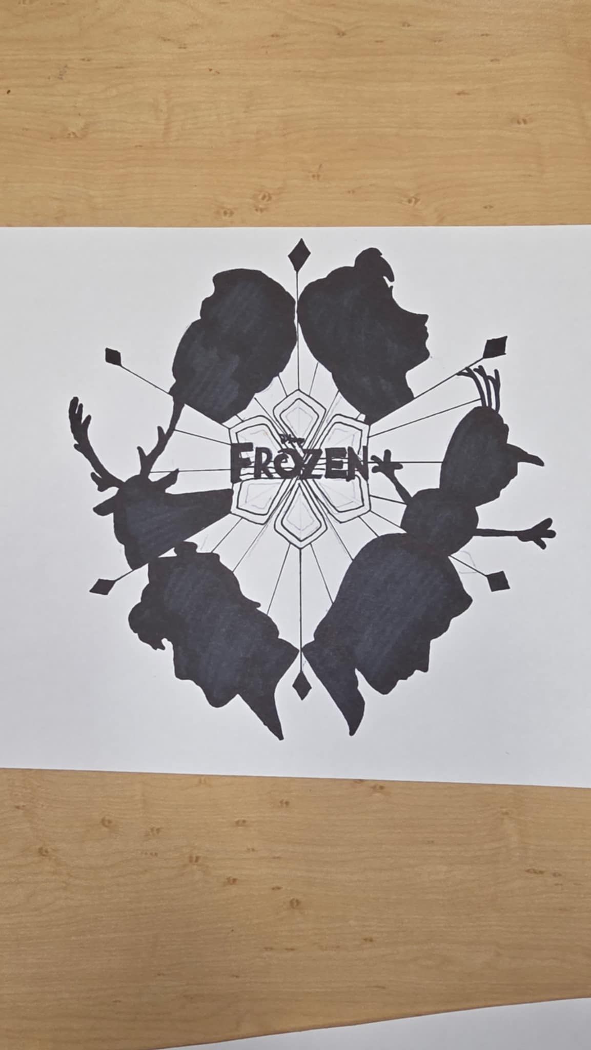 Silhouette design featuring characters from Frozen: Elsa, Anna, Olaf, Kristoff, and Sven. 