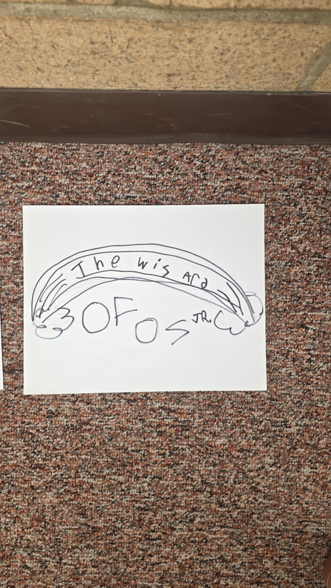 White paper with handwritten words: