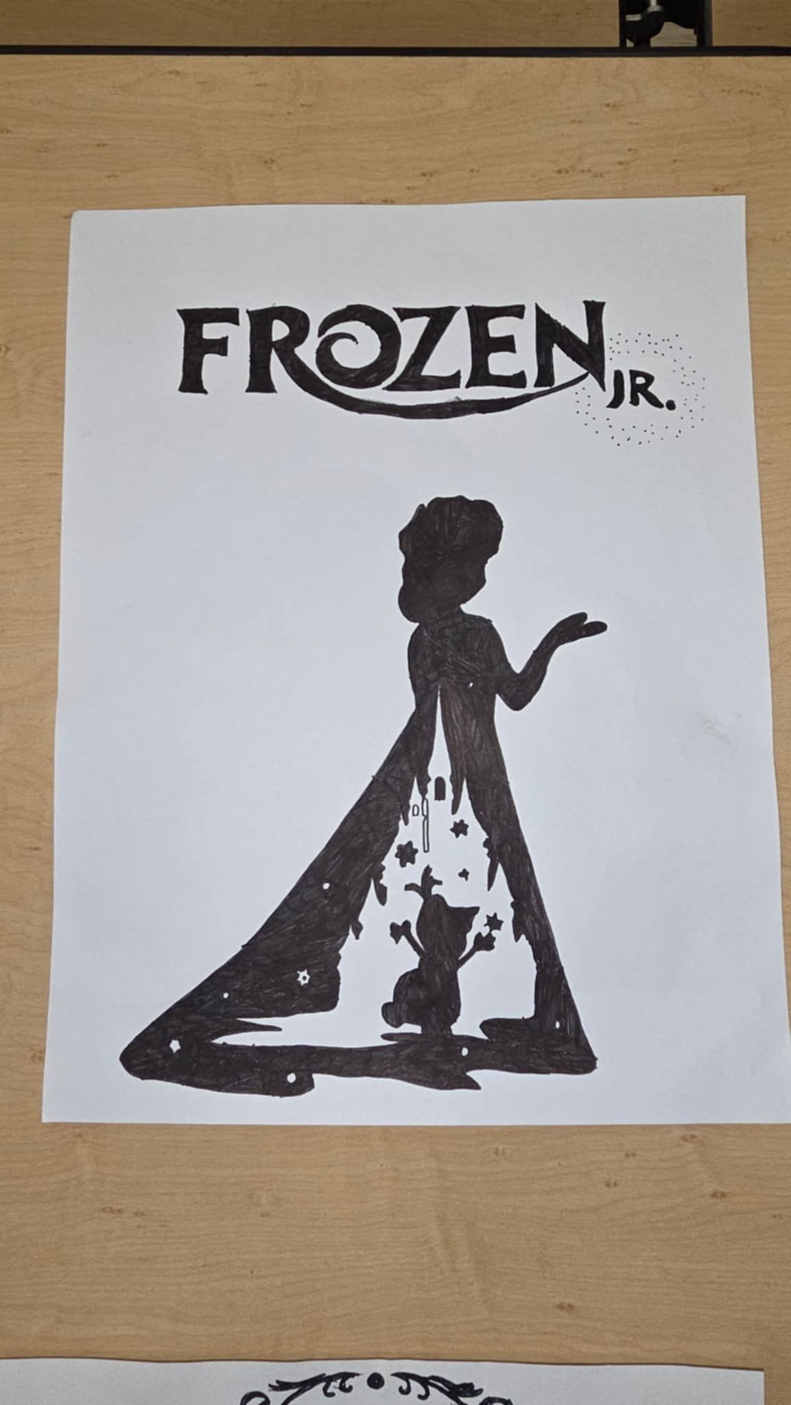 Black and white poster for Frozen Jr. features Elsa's silhouette with star details in her dress.
