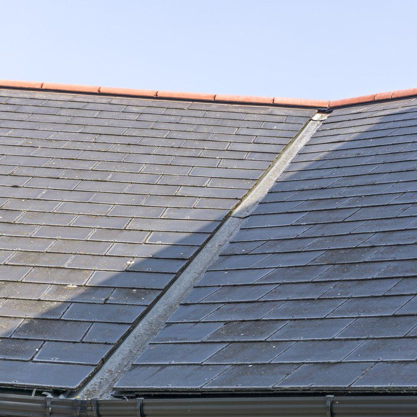 View of a roof showing the lead valley and roof slates.