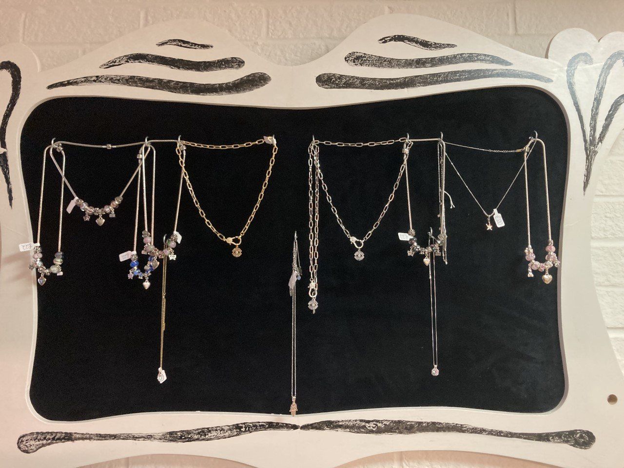 Necklaces on Black stand