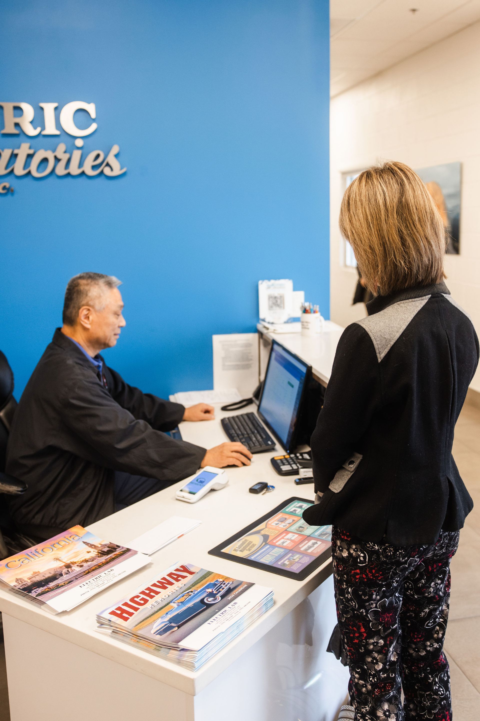 Our Employee with a Client - Electric Laboratories Complete Car Care