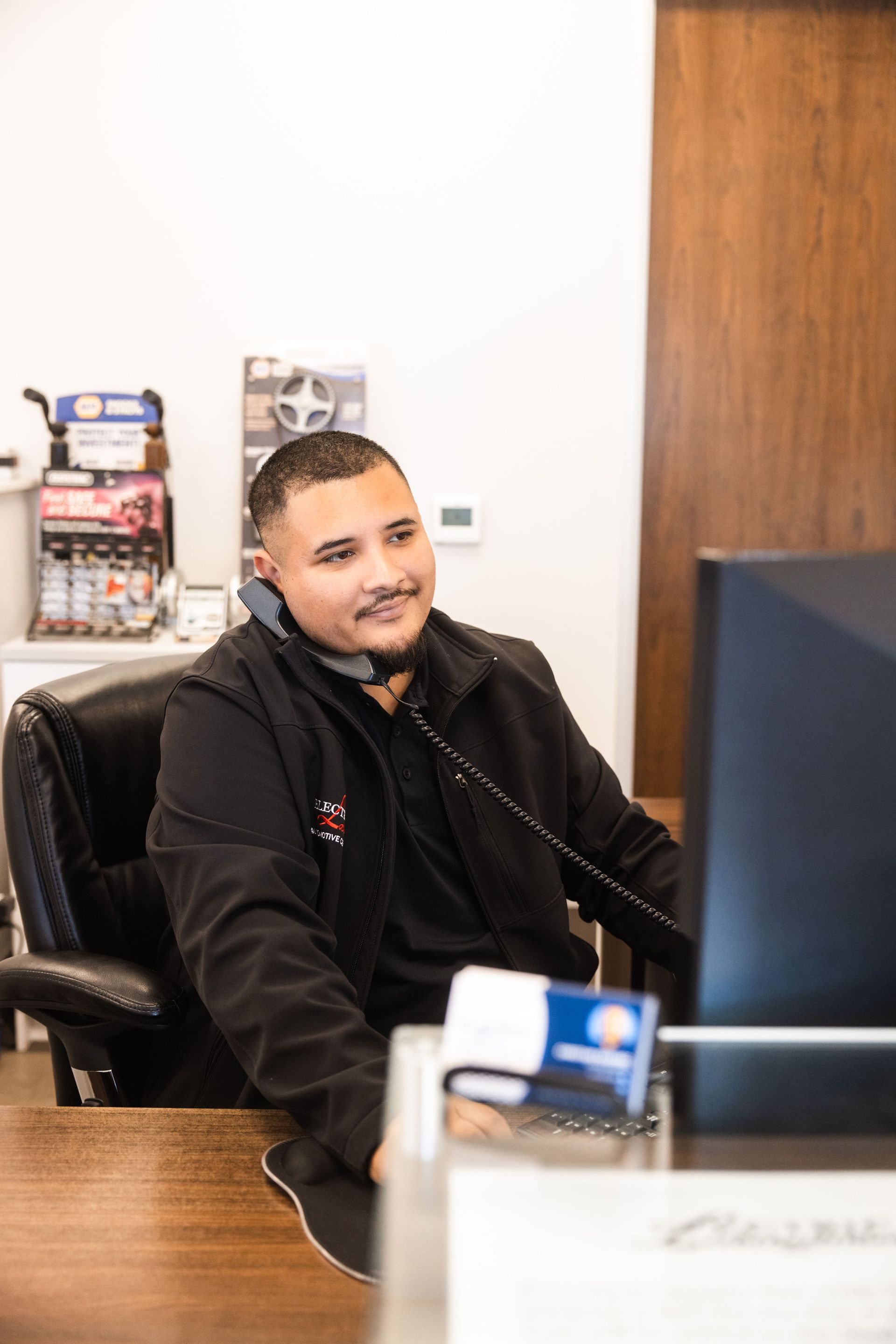 Our Service Advisor Speaks with a Client - Electric Laboratories Complete Car Care