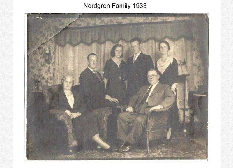 Nordgren family portrait from 1933. Six people posing indoors. Two seated, four standing.