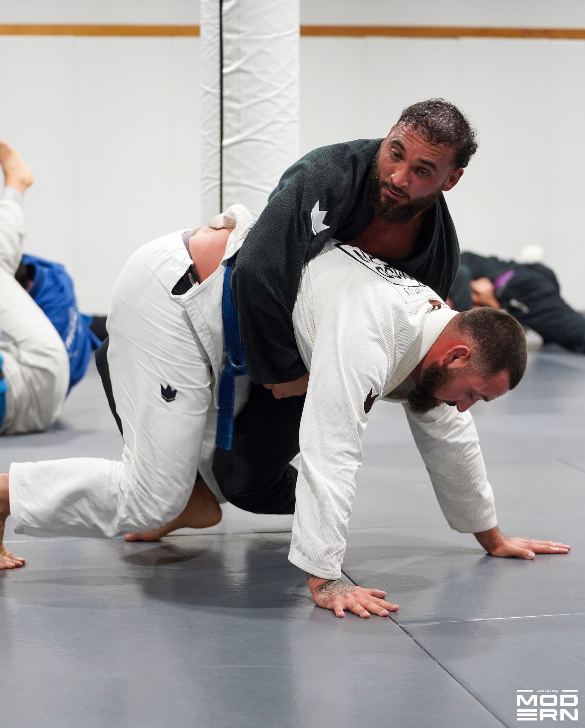 Adults drilling Brazilian Jiu-Jitsu basics at Jiu-Jitsu Modern in North Babylon, NY to build fitness