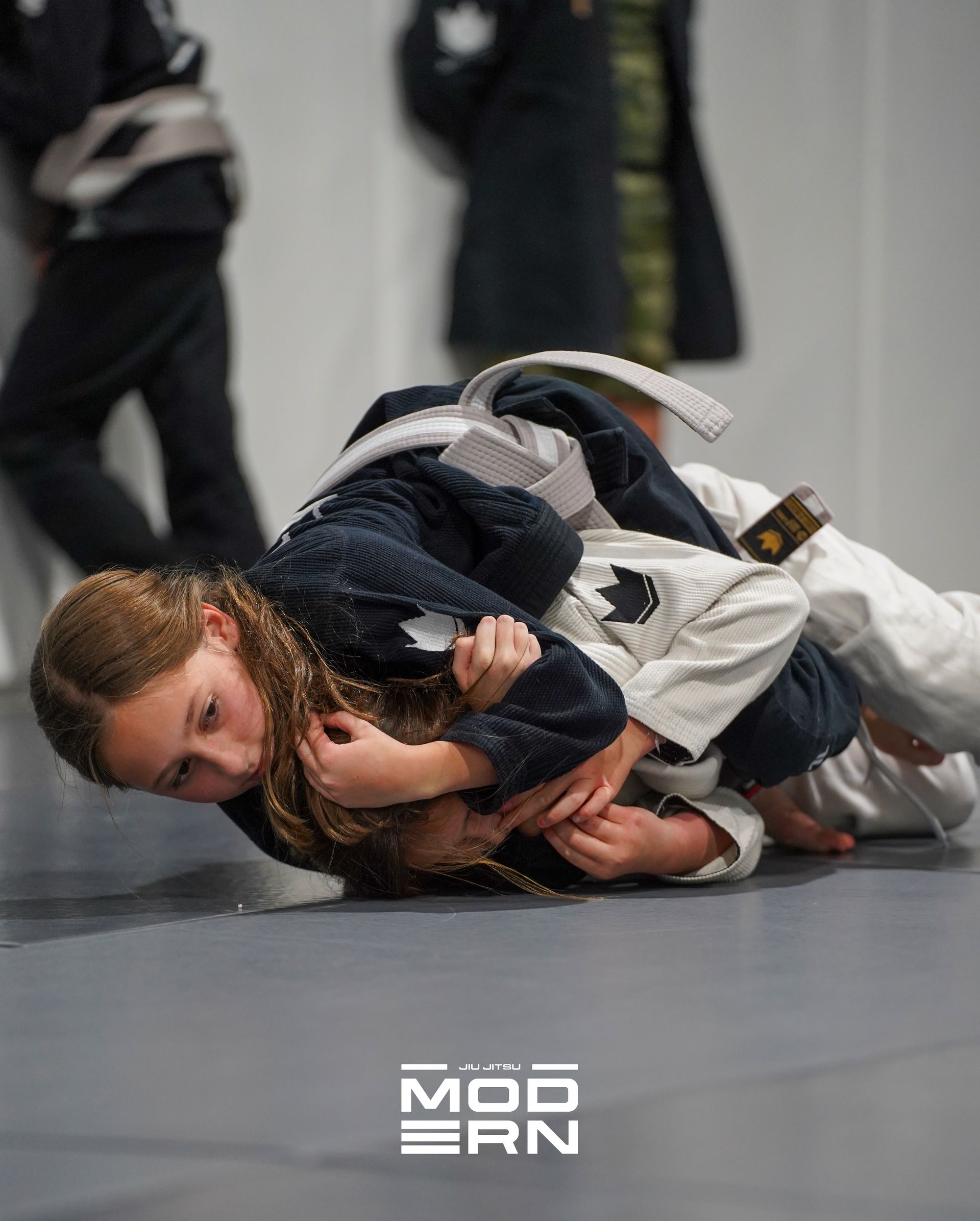 Kids practicing safe grappling drills at Jiu-Jitsu Modern in North Babylon, NY, building confidence.
