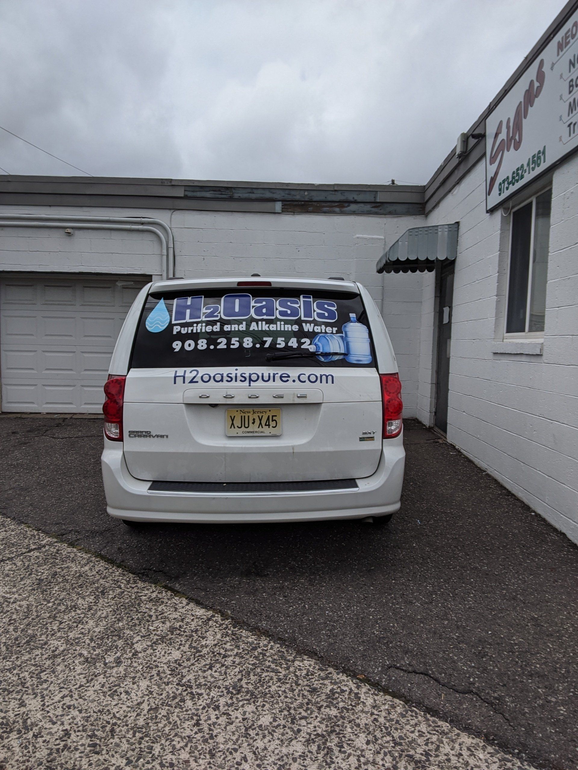 H2 Oasis Printed In The Back Of A Van — Hillside, NJ — Sign Designer