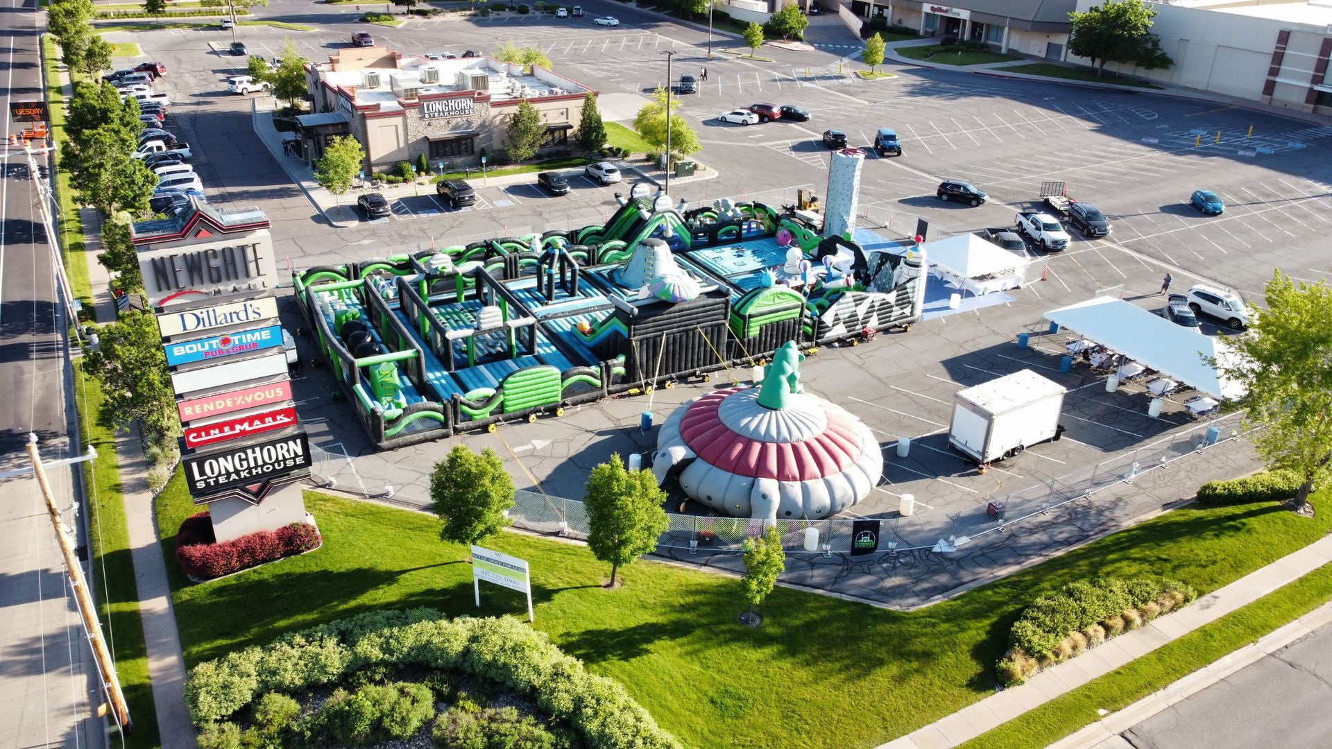 An aerial view of a large inflatable maze in a parking lot.