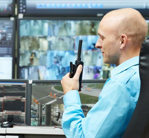 Man Looking at Monitoring System — Essex Junction, VT — Sun Ray Fire & Security