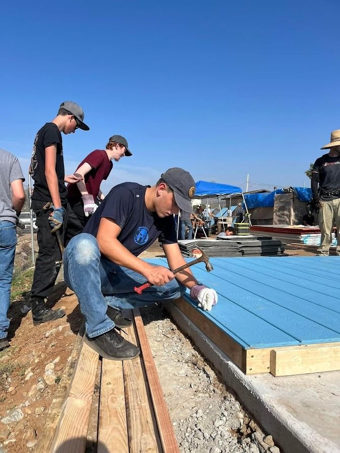 A group of people are working on a construction site.