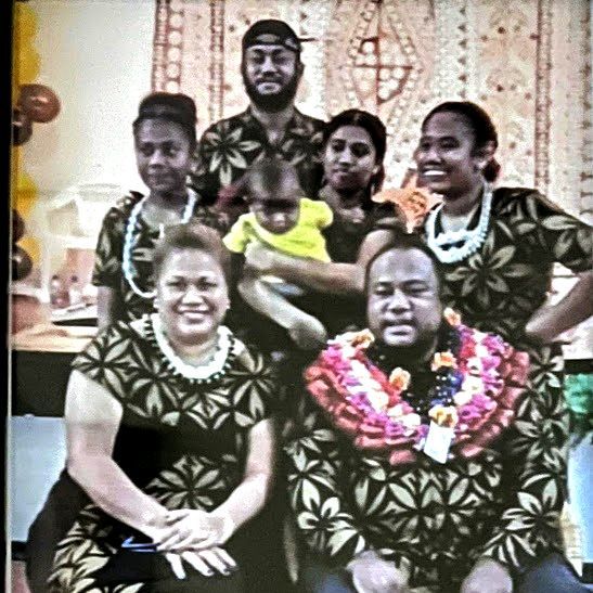 A group of people are posing for a picture together.