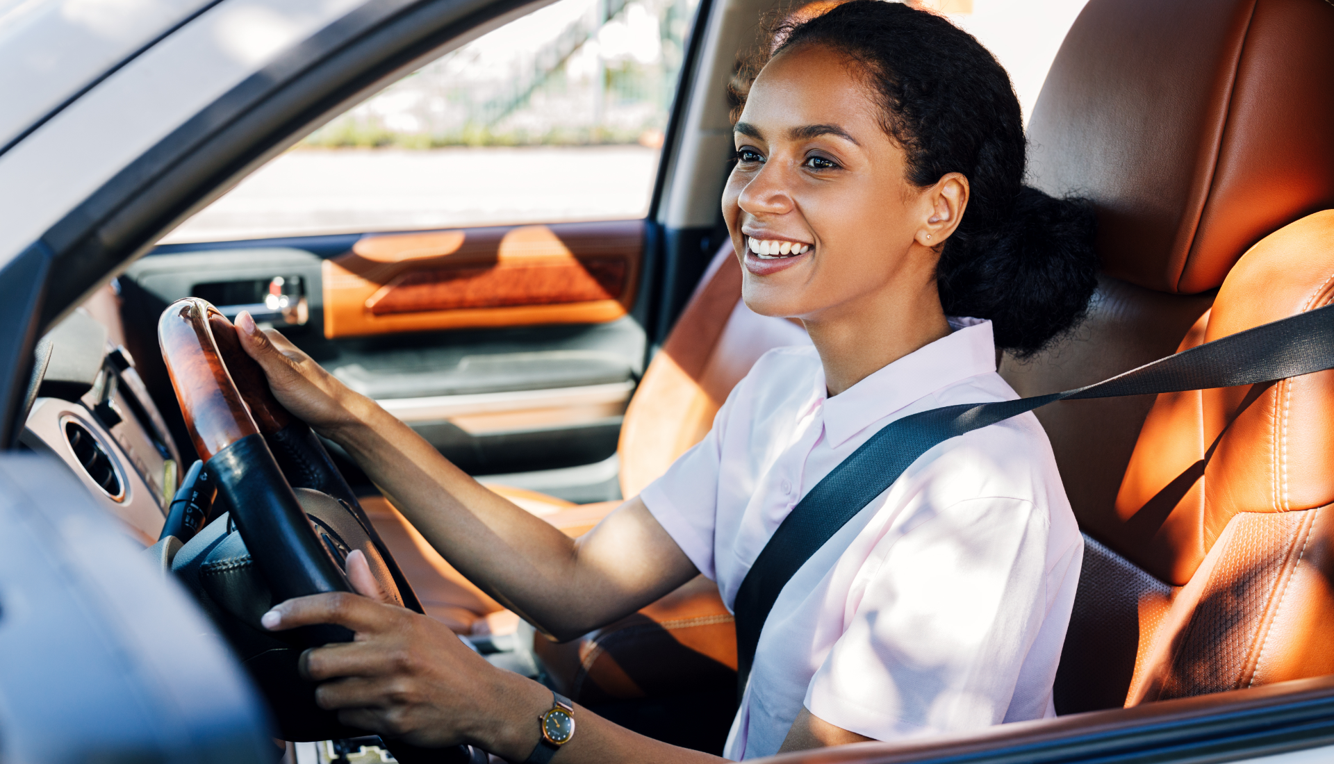 Family outdoors, smiling and talking; man gesturing, elderly man sitting, young girl, and blonde women.
