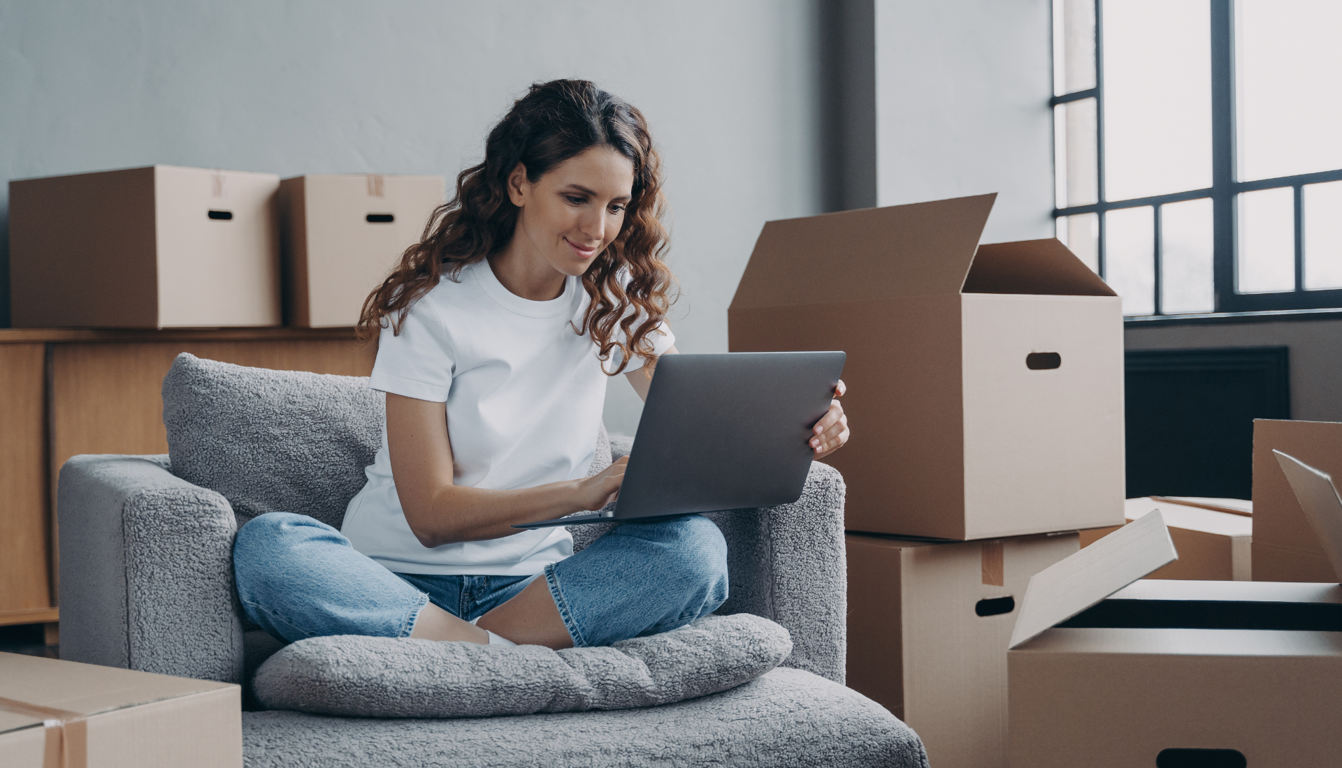 Family outdoors, smiling and talking; man gesturing, elderly man sitting, young girl, and blonde women.