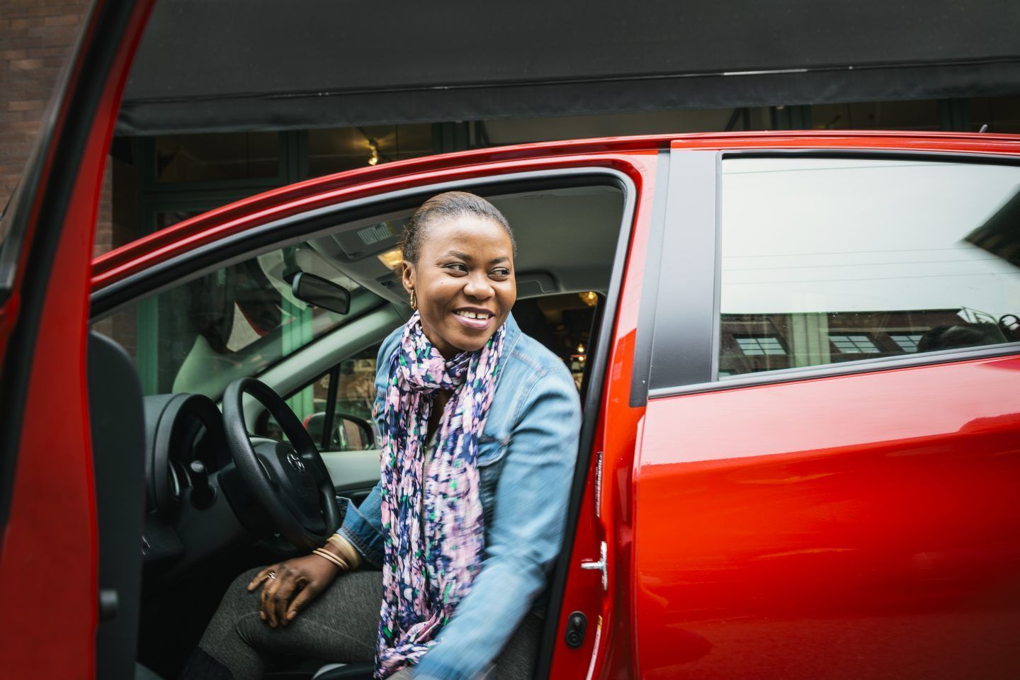 smiling woman has auto insurance