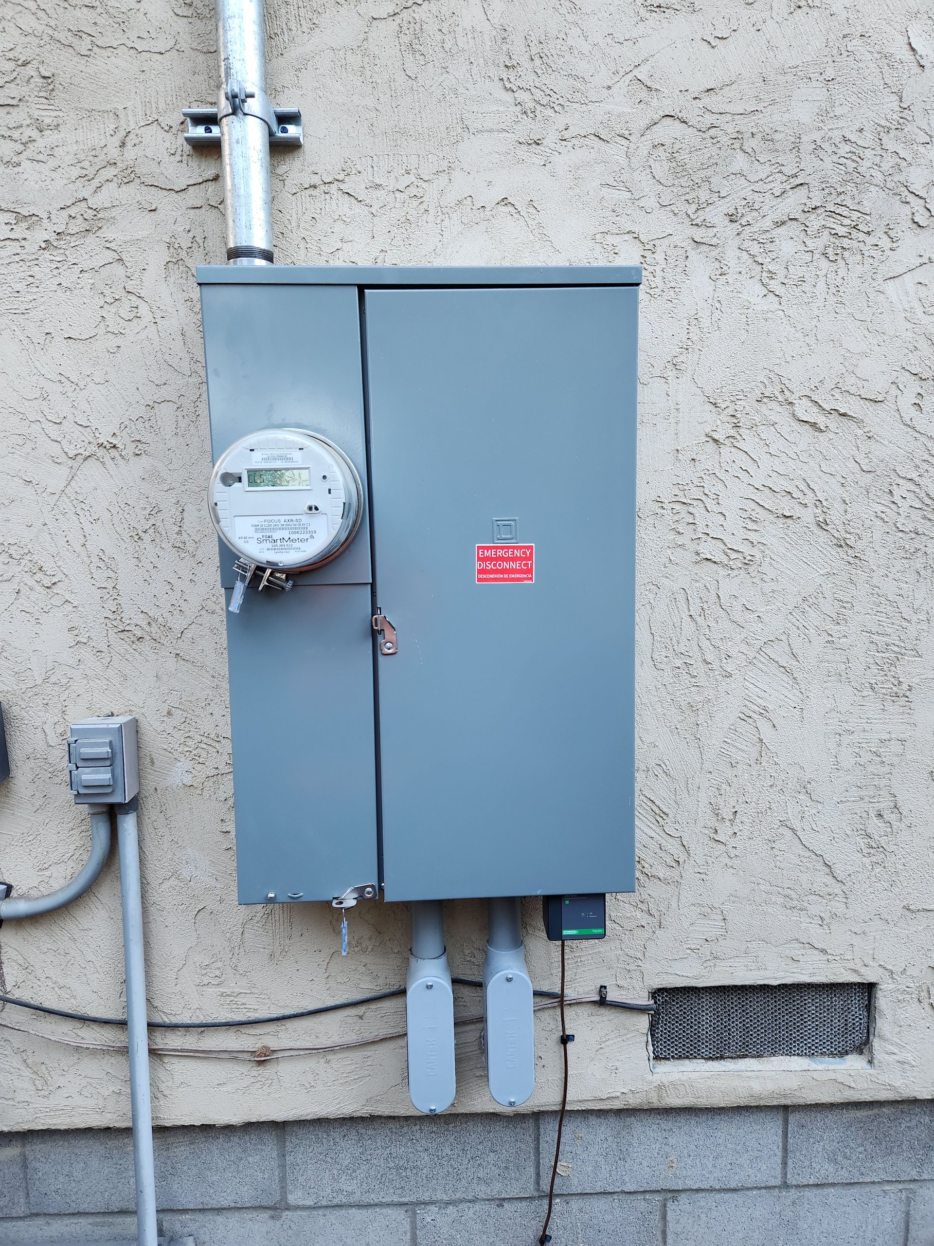 Residential electrical panel upgrade with emergency disconnect switch and smart meter