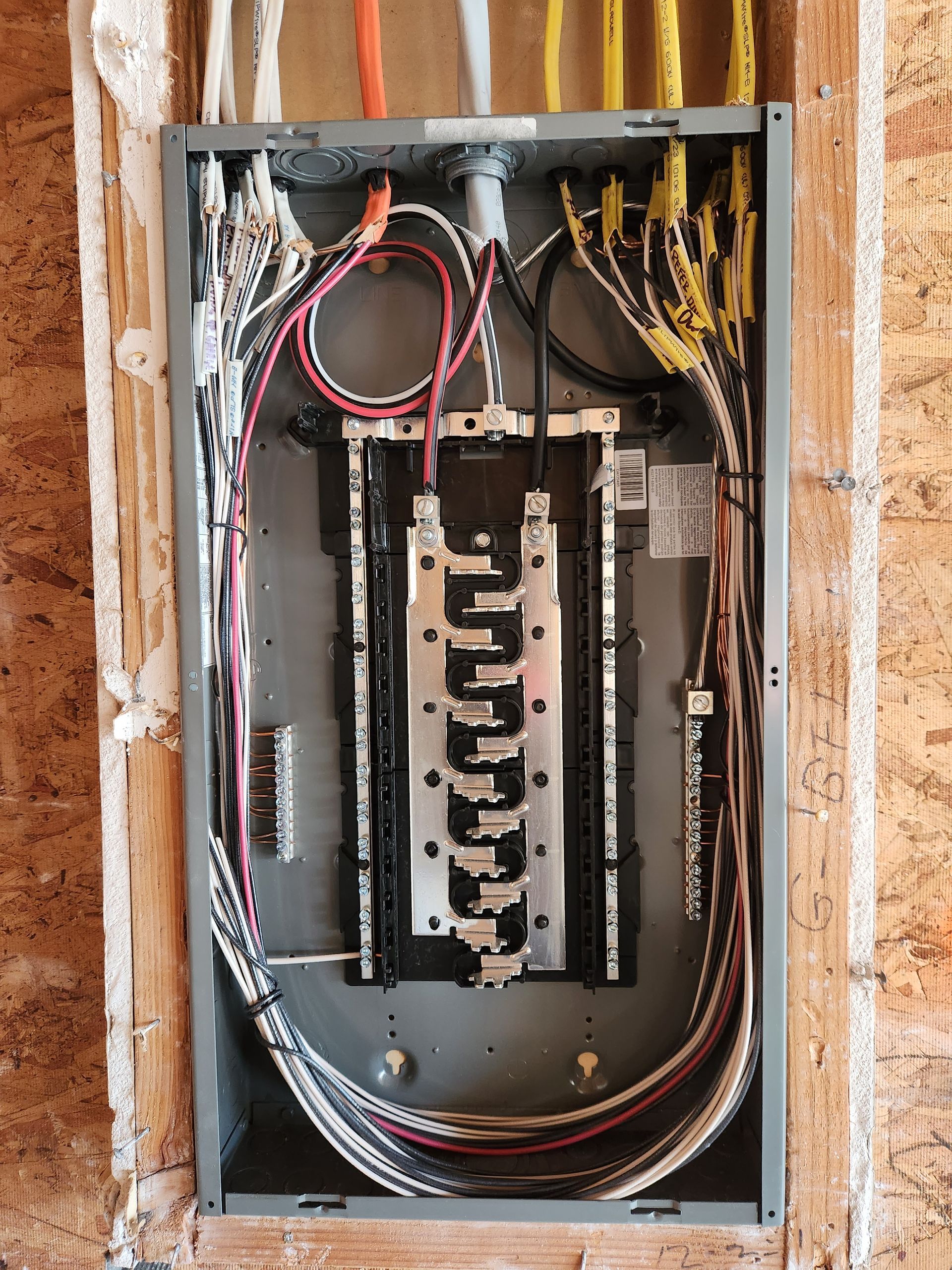Electrical panel upgrade showing detailed internal wiring and circuit labeling