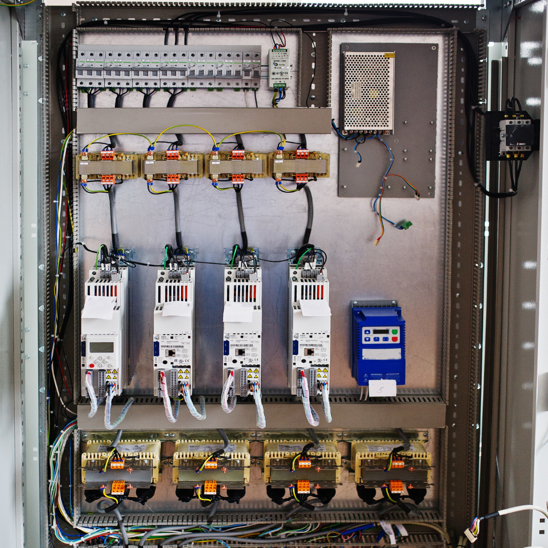 Industrial electrical panel installation with circuit breakers and wiring components