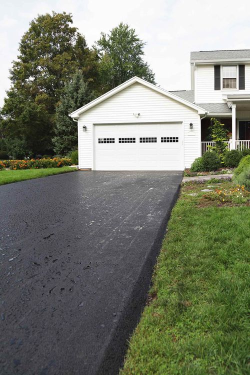 White house with nice driveway — Flint, MI — Countywide Asphalt & Paving