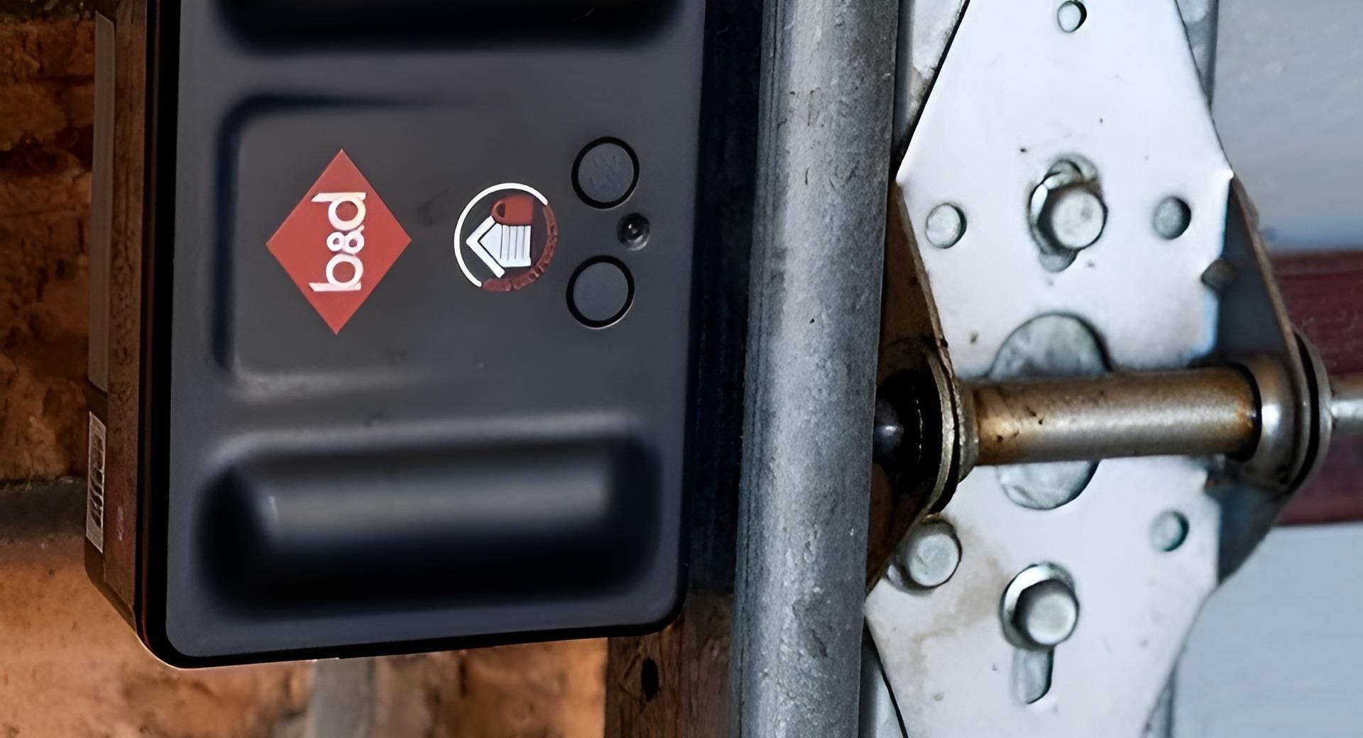 A Black Box With The Word Bed On It Is Attached To A Garage Door — The Roller Door Man NQ In Portsmith, QLD
