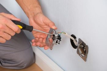 Electrical Remodeling — Electrician Checking the Electrical Equipment in Tacoma, WA