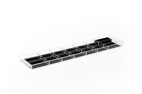 a clear acrylic tray with black dividers on a white background .