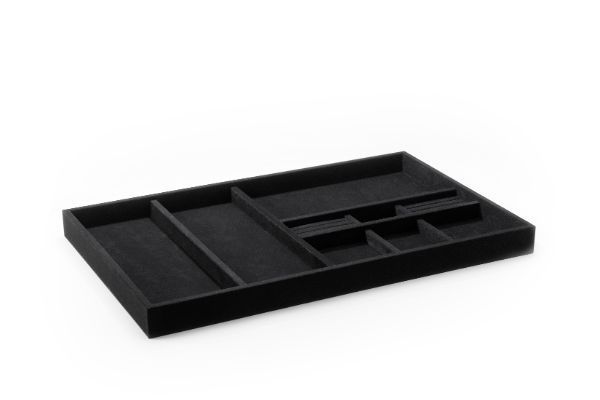 a velveteen black tray with dividers on a white background .