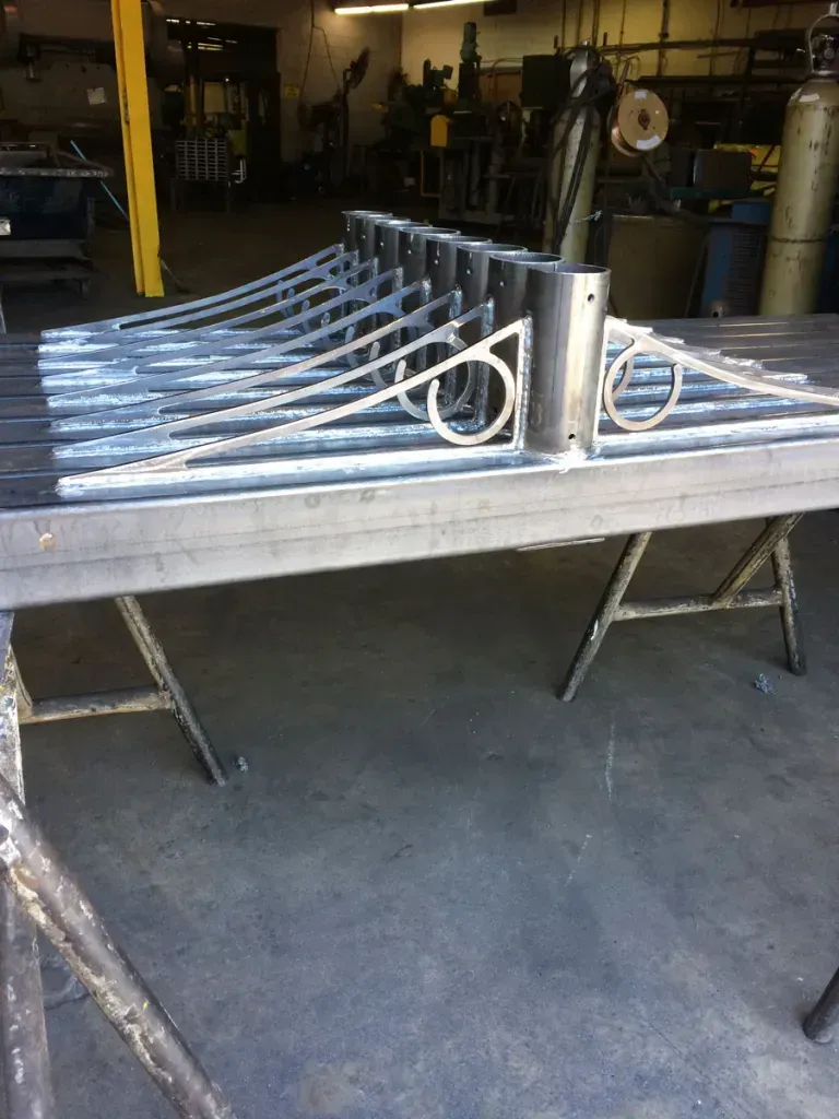 A table with a bunch of metal pieces on it