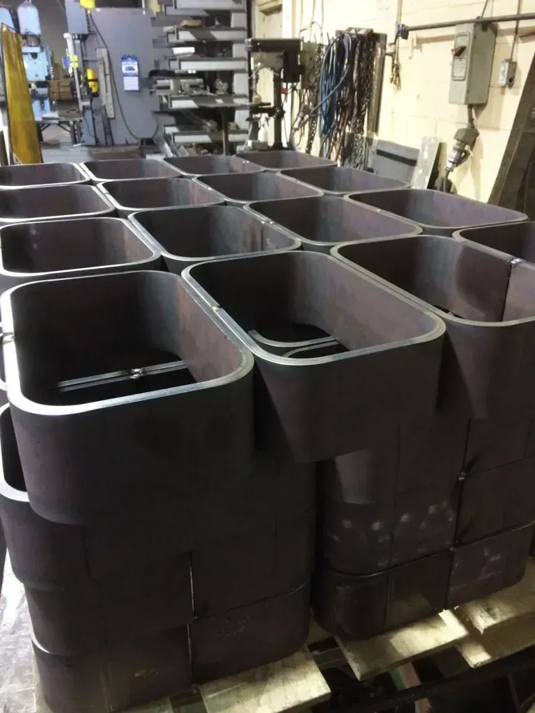 A bunch of metal containers are stacked on top of each other