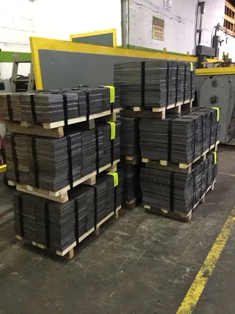 A bunch of pallets stacked on top of each other in a warehouse