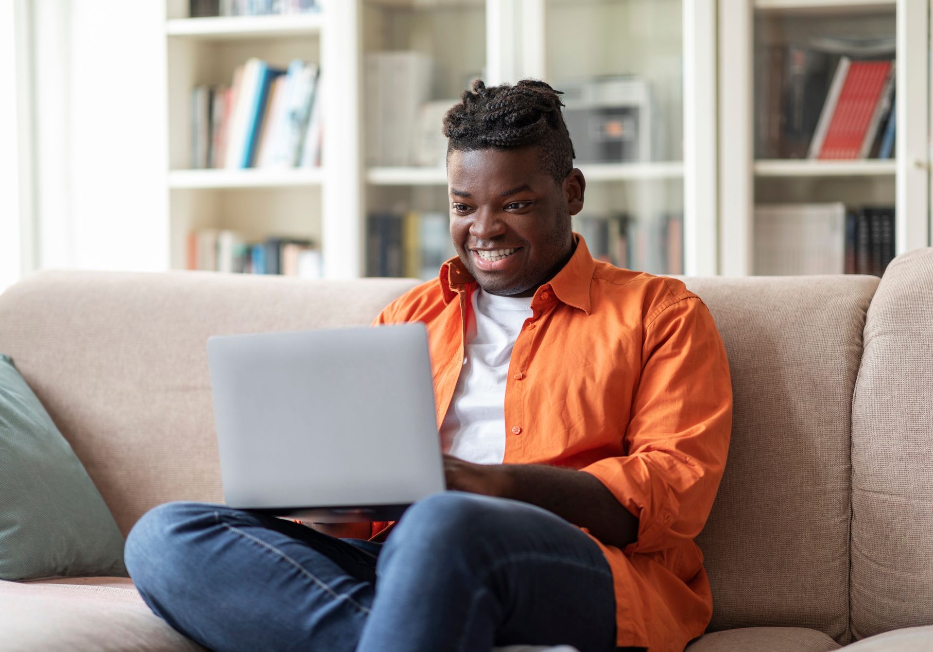 A group of people are standing around a coffin at a funeral.