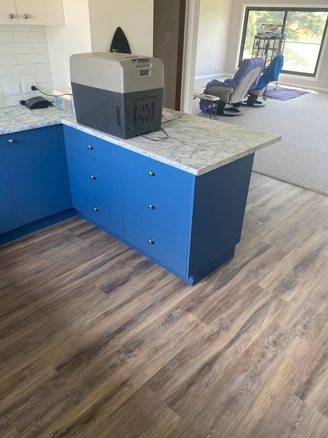 A Cooler Is Sitting On Top Of A Counter In A Kitchen — Cabonne Carpets In Molong, NSW