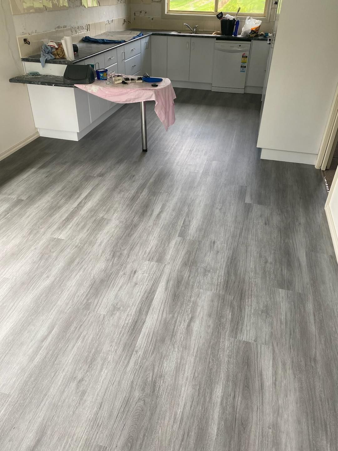 A Kitchen With A Table And A Gray Floor — Cabonne Carpets In Molong, NSW