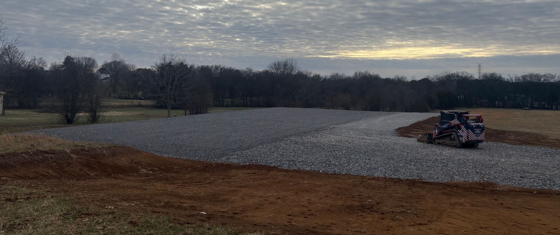 A house is being built in the middle of a field.
